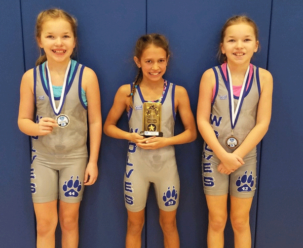 Three Walker-Hackensack-Akeley elementary students competed Saturday at a girls’ wrestling tournament in Sartell. Ella Henning (center) took first with two pins, Emylie Freeman (left) finished second with one pin and Elayna Freeman was third. The girls will compete this weekend at a tournament in Proctor.